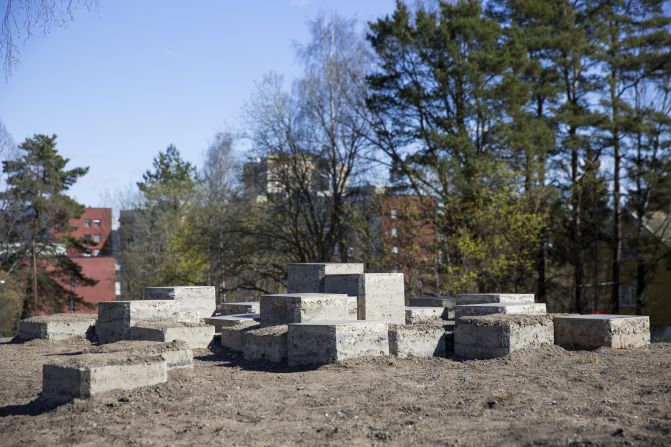 Beijing architect Naihan Li created a seating landscape comprising a cluster of rammed-earth extrusions topped with metal plates or grass that will grow in over time. The construction method references the materiality of the Great Wall of China, and the pixelated form is reminiscent of classic computer games.