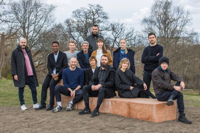 A group portrait of the architects and curators.