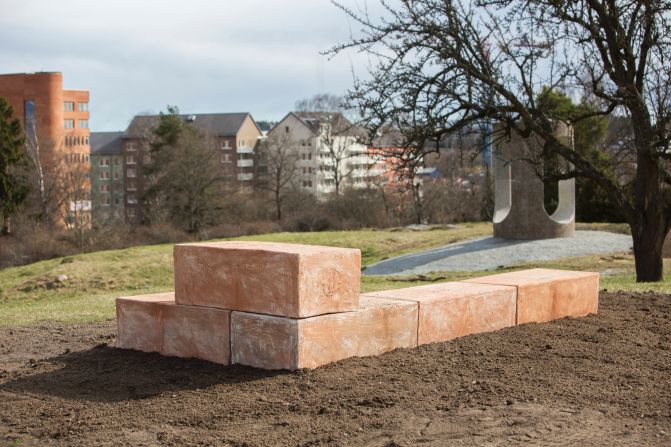 Italian architect Luca Cipelletti uses dried cow dung mixed with clay to create a material he calls Merdacotta. This material was used to create gigantic bricks compiled in an L-shape that encourages users to sit in different ways and enjoy various views of the park.