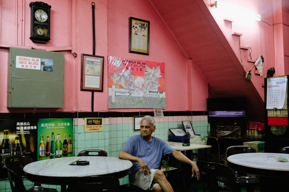 <strong>Sinhalese Bar: </strong>The Sinhalese Bar, founded in 1931, offers cowboy-style swing doors and bygone charm. Alfred Perera, pictured here, was born and bred in this shophouse and still lives upstairs.
