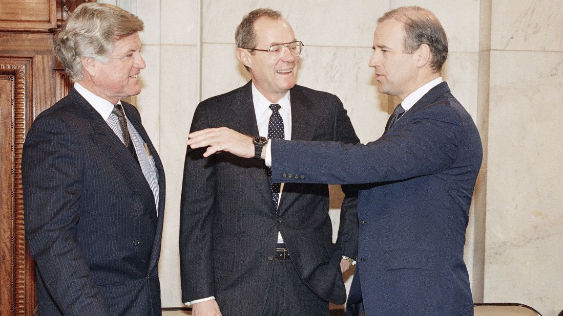 Kennedy, center, talks with US Sens. Ted Kennedy, left, and Joe Biden before a confirmation hearing in Washington. The two Kennedys are not related.