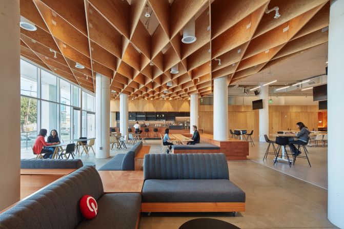 The San Francisco design for Pinterest's new headquarters was formerly a John Deere factory. A diagrid waffle ceiling made from plywood acts as a canopy above spaces used for public events and programs.