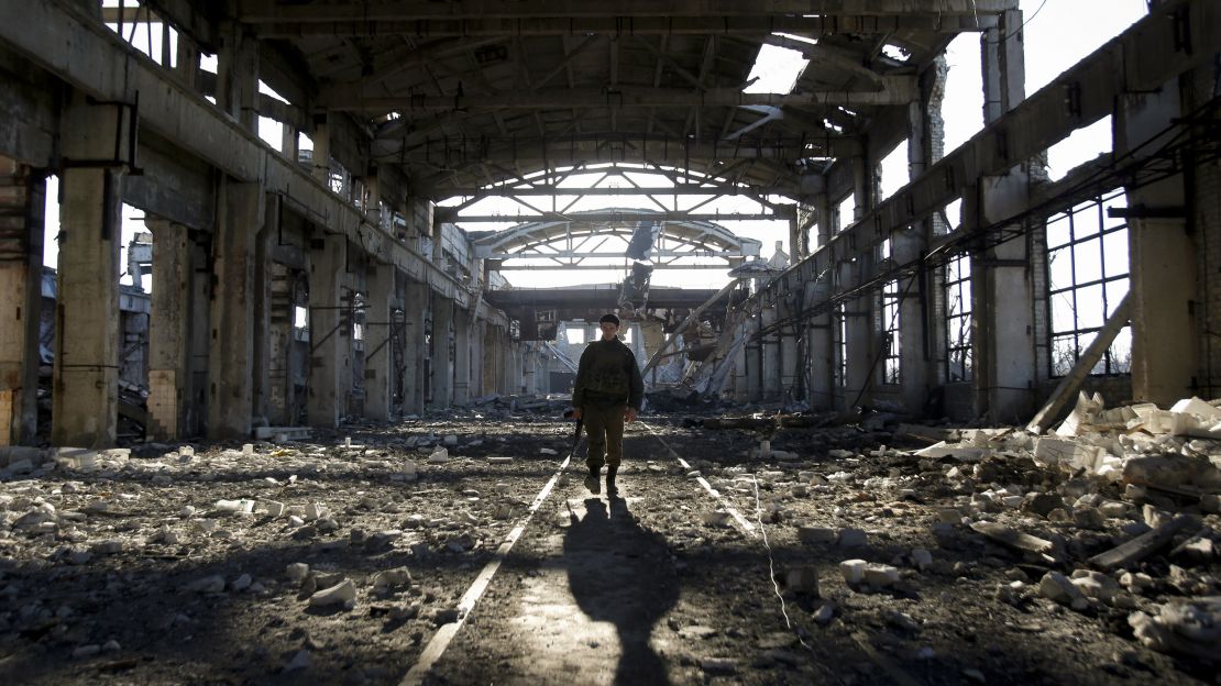 A Ukrainian serviceman walks through the rubble of a destroyed workshop after fighting with pro-Russian separatists in Avdiivka, Donetsk region on March 31, 2017.