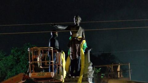 Workers prepare to remove the statue of Jefferson Davis. 