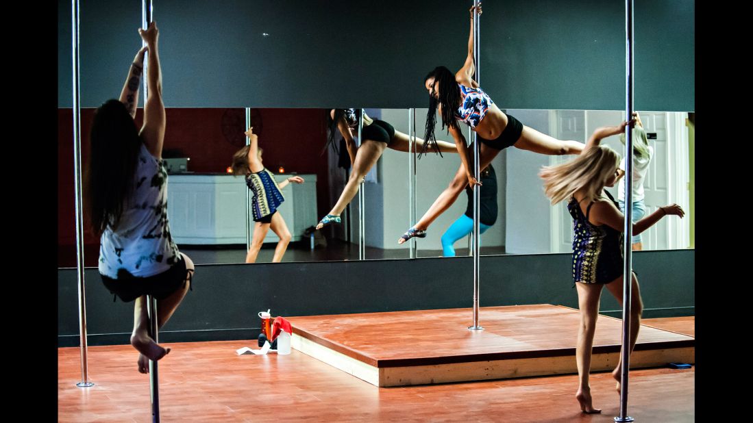 Atiya Hodges, center, teaches a pole dancing class at Taboo Dance & Fitness in Bowling Green, Kentucky. Experts say the class is a demanding one that requires skill and technique, which in turn uses energy.