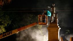 Workers prepare to take down the Jefferson Davis statue in New Orleans, Thursday, May 11, 2017. This was the second of four Confederate monuments slated for removal in a contentious process that has sparked protests on both sides. (AP Photo/Gerald Herbert)