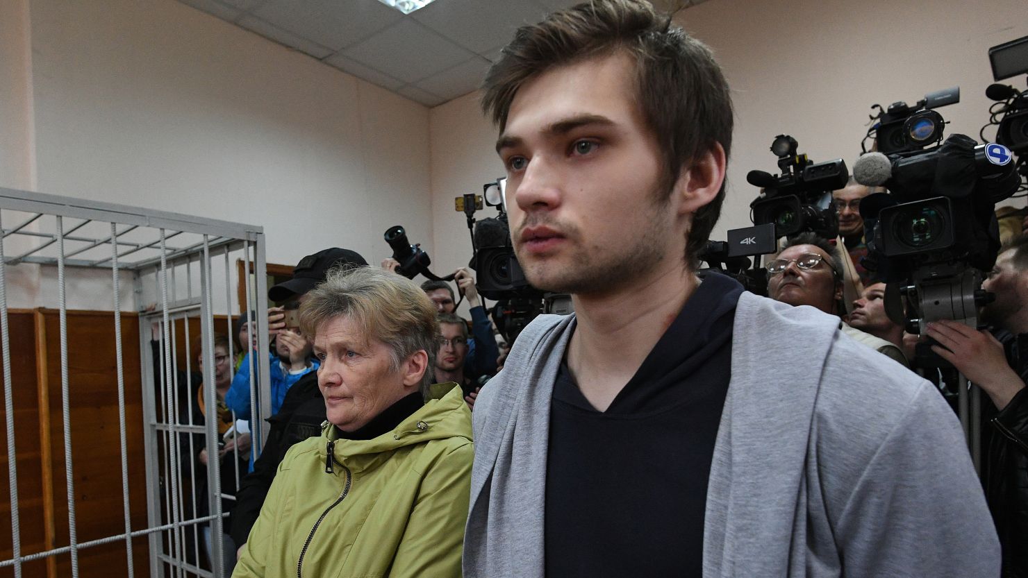Russian blogger Ruslan Sokolovsky, right, attends a court hearing Thursday after he was charged for filming a Pokemon Go video in a church.