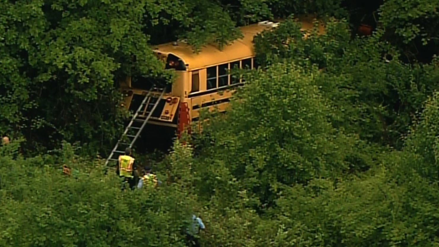 A school bus veers off I-44 near St. Louis on Thursday to avoid a careening car, officials say.