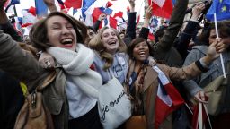 Supporters of French presidential election candidate for the En Marche ! movement Emmanuel Macron celebrate in front of the Pyramid at the Louvre Museum in Paris on May 7, 2017, following the announcement of the results of the second round of the French presidential election.
Emmanuel Macron was elected French president on May 7, 2017 in a resounding victory over far-right Front National (FN - National Front) rival after a deeply divisive campaign, initial estimates showed. / AFP PHOTO / Patrick KOVARIK        (Photo credit should read PATRICK KOVARIK/AFP/Getty Images)
