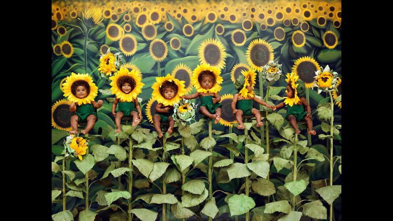 Children are posed as sunflowers in this 1998 photo by Anne Geddes. In her newest book, <a href="https://www.taschen.com/pages/en/catalogue/photography/all/05305/facts.anne_geddes_small_world.htm" target="_blank" target="_blank">"Small World,"</a> Geddes reflects on a career that has spanned three decades. There are many photos in the book that have never been published before. 