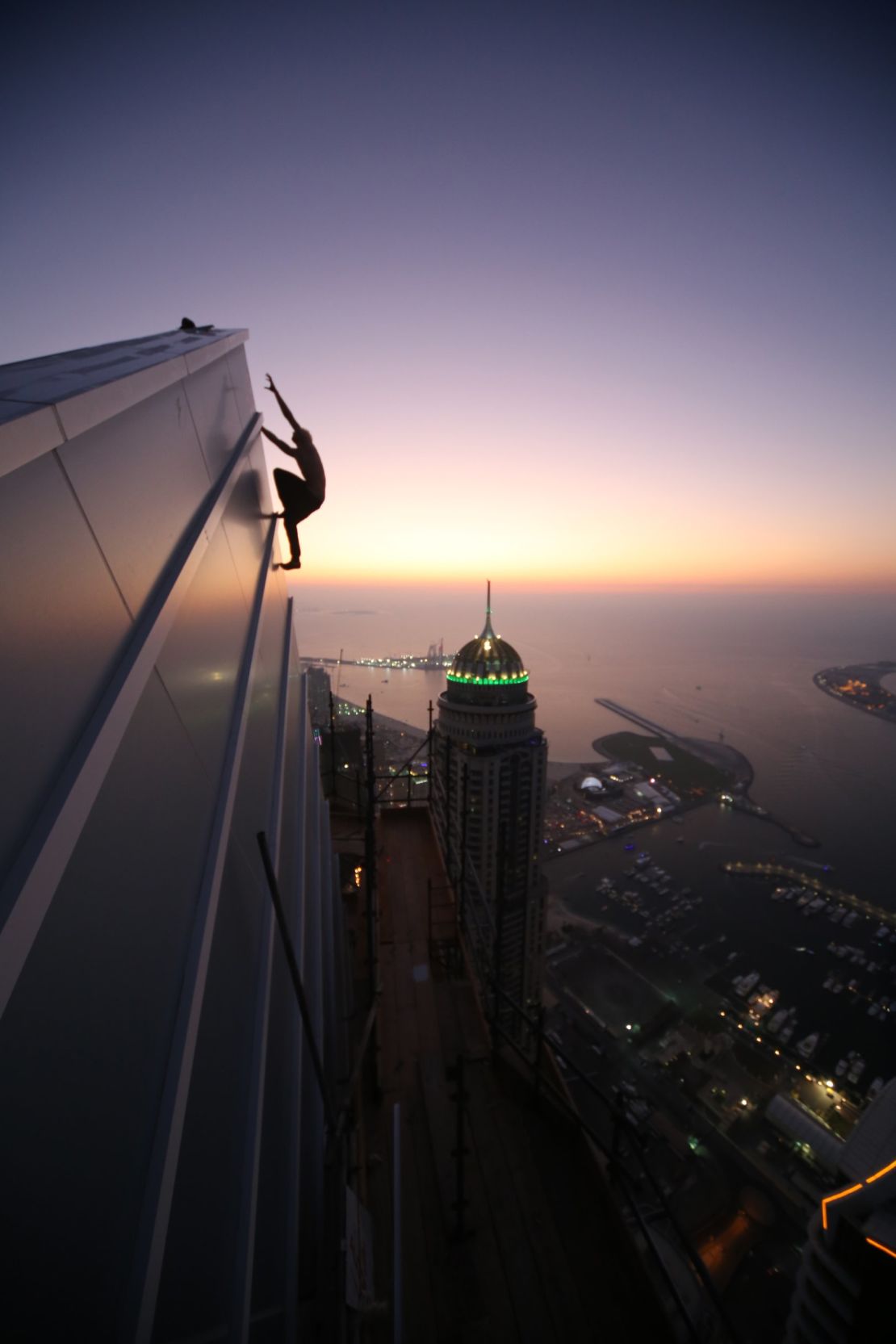 Urban climber Oleg Cricket in action in Dubai, December 2015. Not all urban climbing activity in the city is legal, but Dubai's many skyscrapers have proved tempting for practitioners.