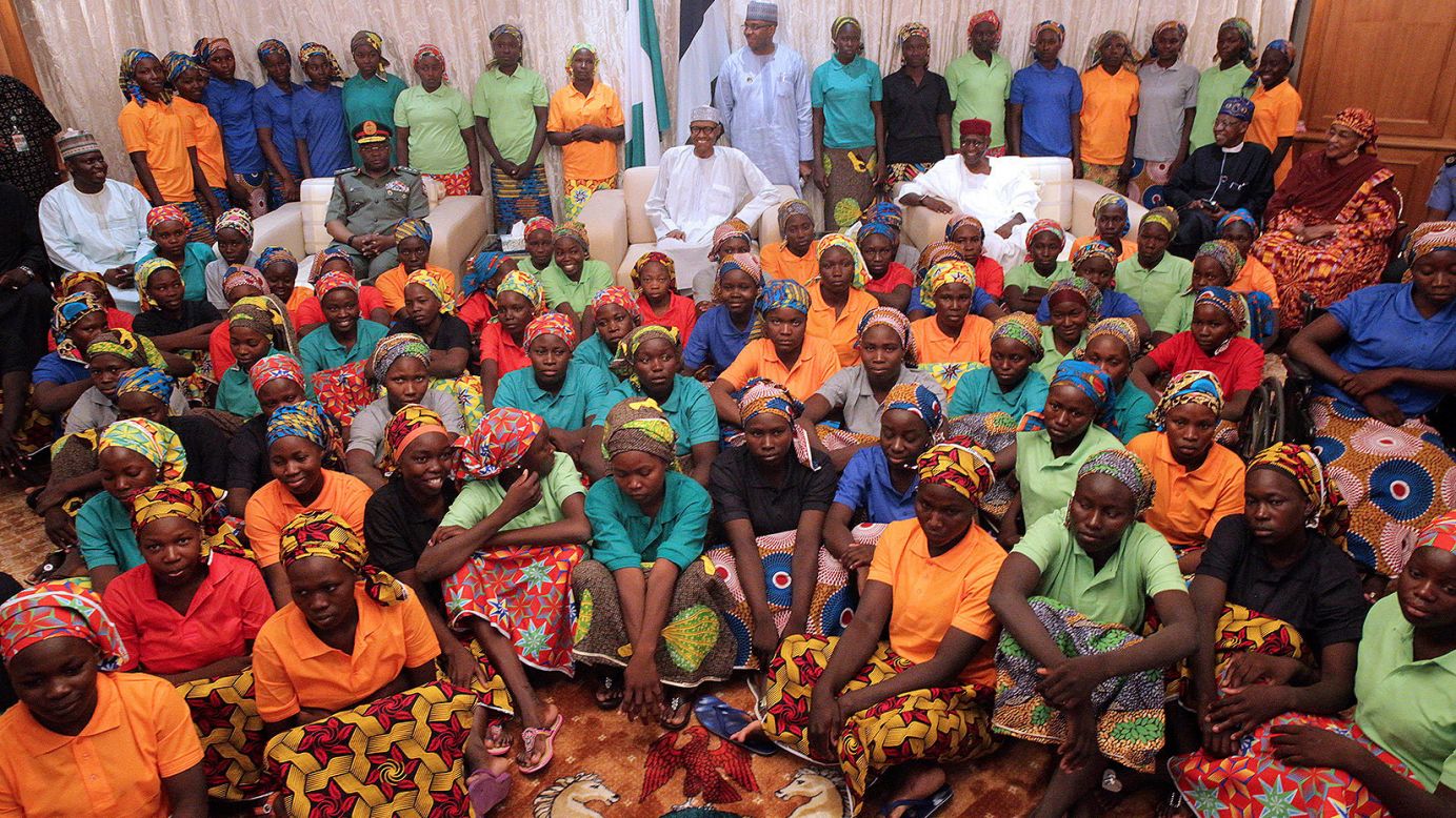 In this photo released by the Nigeria State House on Sunday, May 7, Nigerian President Muhammadu Buhari -- at center, in the glasses -- meets with the 82 Chibok schoolgirls who were recently released by the terrorist group Boko Haram. The Nigerian government freed five Boko Haram commanders in what was <a href="http://www.cnn.com/2017/05/07/africa/chibok-girls-released/index.html" target="_blank">a swap deal,</a> said Sen. Shehu Sani, who was part of the negotiating effort. More than 100 girls remain in Boko Haram custody.