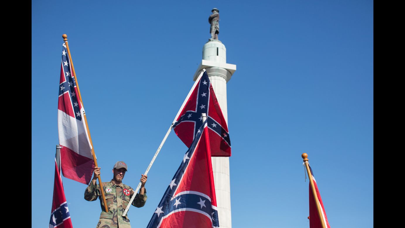 A man holds Confederate flags in New Orleans on Sunday, May 7, as he protests <a href="http://www.cnn.com/2017/05/11/us/new-orleans-confederate-monument-removal/" target="_blank">the city's removal of Confederate monuments.</a> Mayor Mitch Landrieu's office said the statues will go to storage while the city looks for a suitable venue to display them.