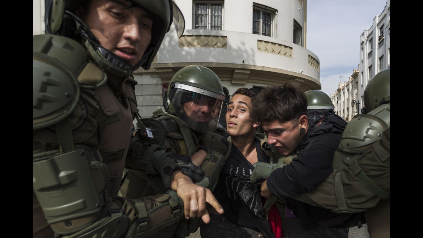 A demonstrator is detained in Santiago, Chile, on Tuesday, May 9. People marched in cities across Chile to call for free higher education and an end to student debt.