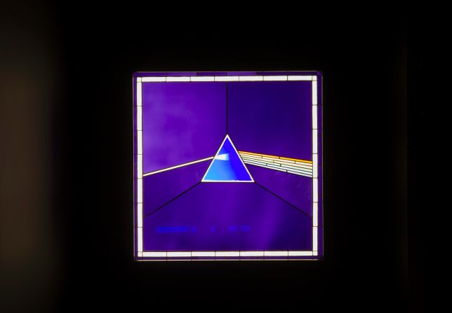 Pink Floyd's "Dark Side of the Moon" album cover on display at the Victoria and Albert Museum. 