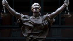 A statue of Justice is seen outside as a sentencing hearing takes place for Marcel Lehel Lazar, a hacker known as Guccifer, at the Albert V. Bryan US federal courthouse September 1, 2016 in Alexandria, Virginia.
Lazar earlier pleaded guilty to unauthorized access to a protected computer and aggravated identity theft. 'Guccifer' allegedly published correspondence that led to the discovery of former US Secretary of State Hillary Clinton's private email server system. / AFP / Brendan Smialowski        (Photo credit should read BRENDAN SMIALOWSKI/AFP/Getty Images)