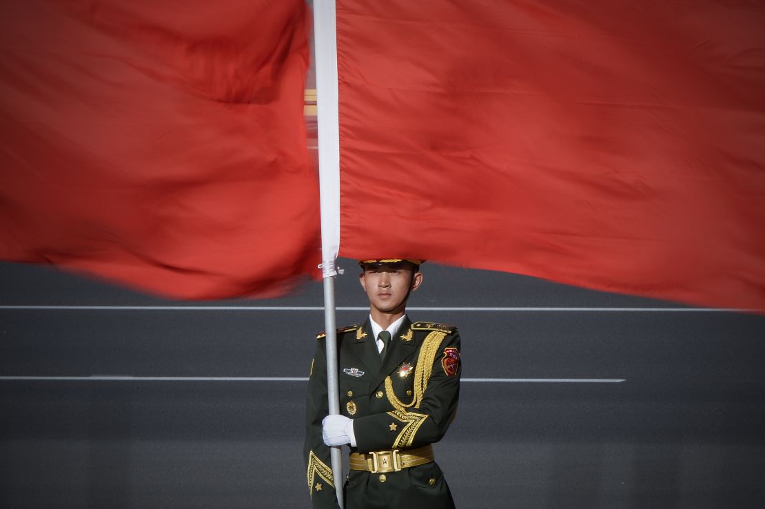 A Chinese honour guard holds the national flag at the Great Hall of the People in Beijing.