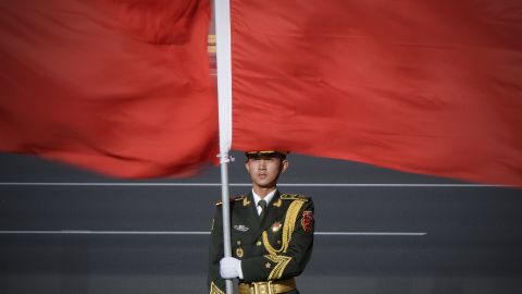 A Chinese honour guard holds the national flag at the Great Hall of the People in Beijing.