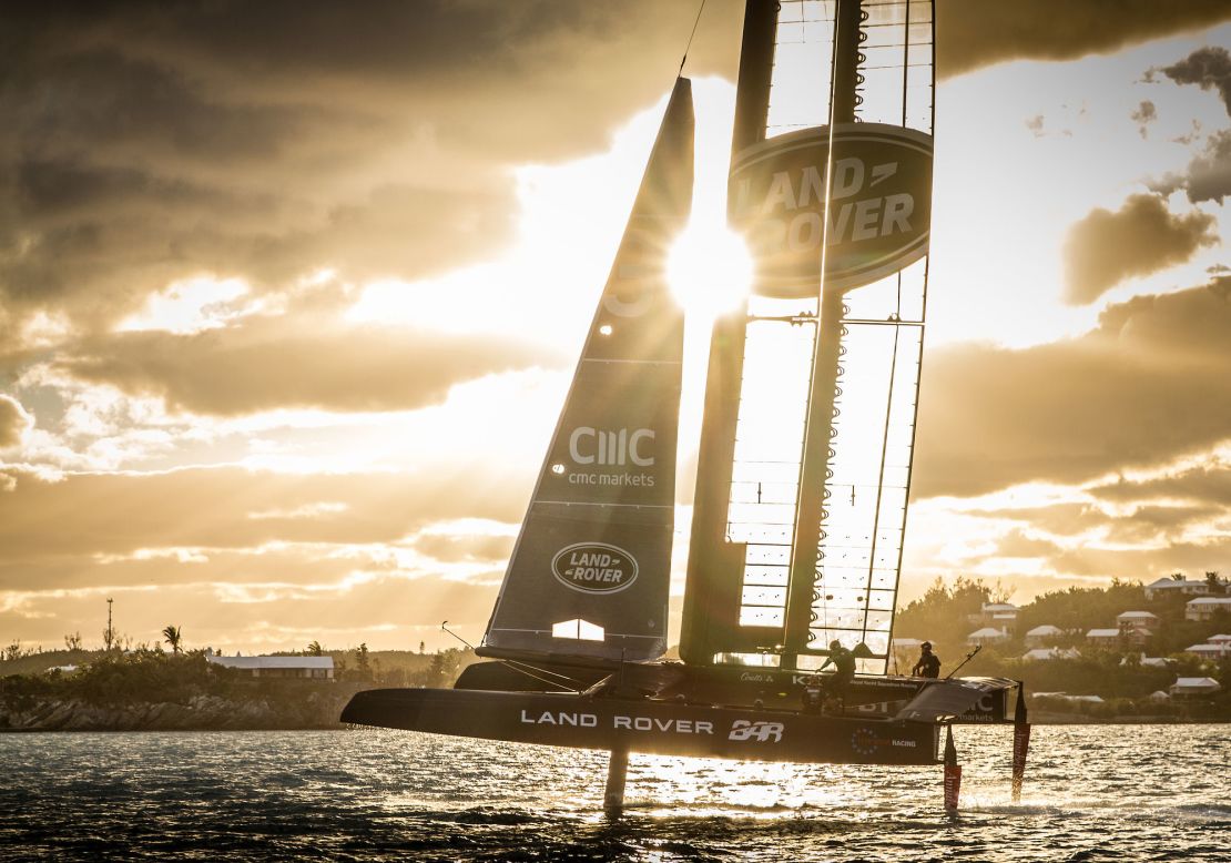 The sun cuts through the main sail of the Land Rover BAR race boat.