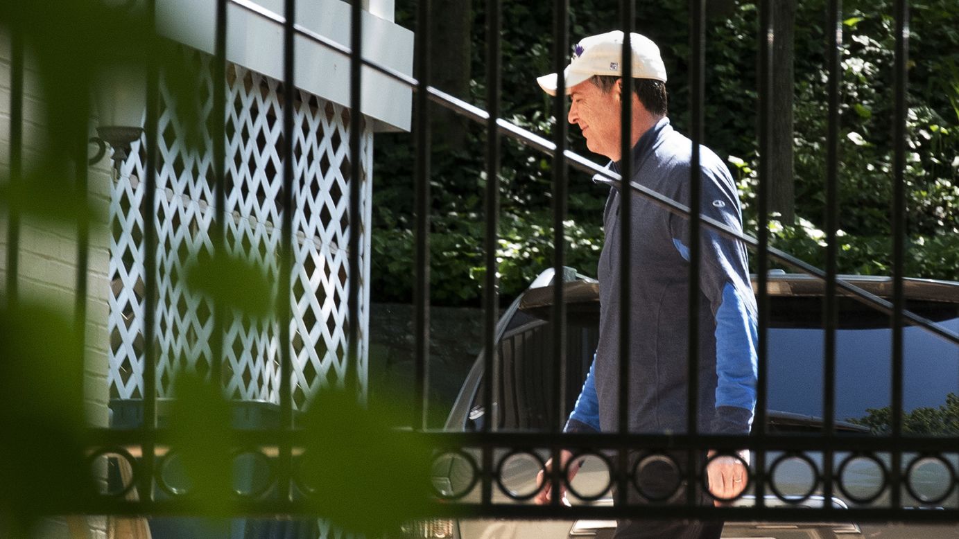 Former FBI Director James Comey walks at his home in McLean, Virginia, on Wednesday, May 10. Comey was dismissed from his post, the White House said, on the recommendation of Attorney General Jeff Sessions and Deputy Attorney General Rod Rosenstein. They cited Comey's handling of the probe into Hillary Clinton's use of a private email server, a controversy that many believe helped Trump defeat Clinton in the 2016 election. <a href="http://www.cnn.com/2016/07/07/politics/who-is-james-comey-fbi-director-things-to-know/index.html" target="_blank">7 things to know about James Comey</a>