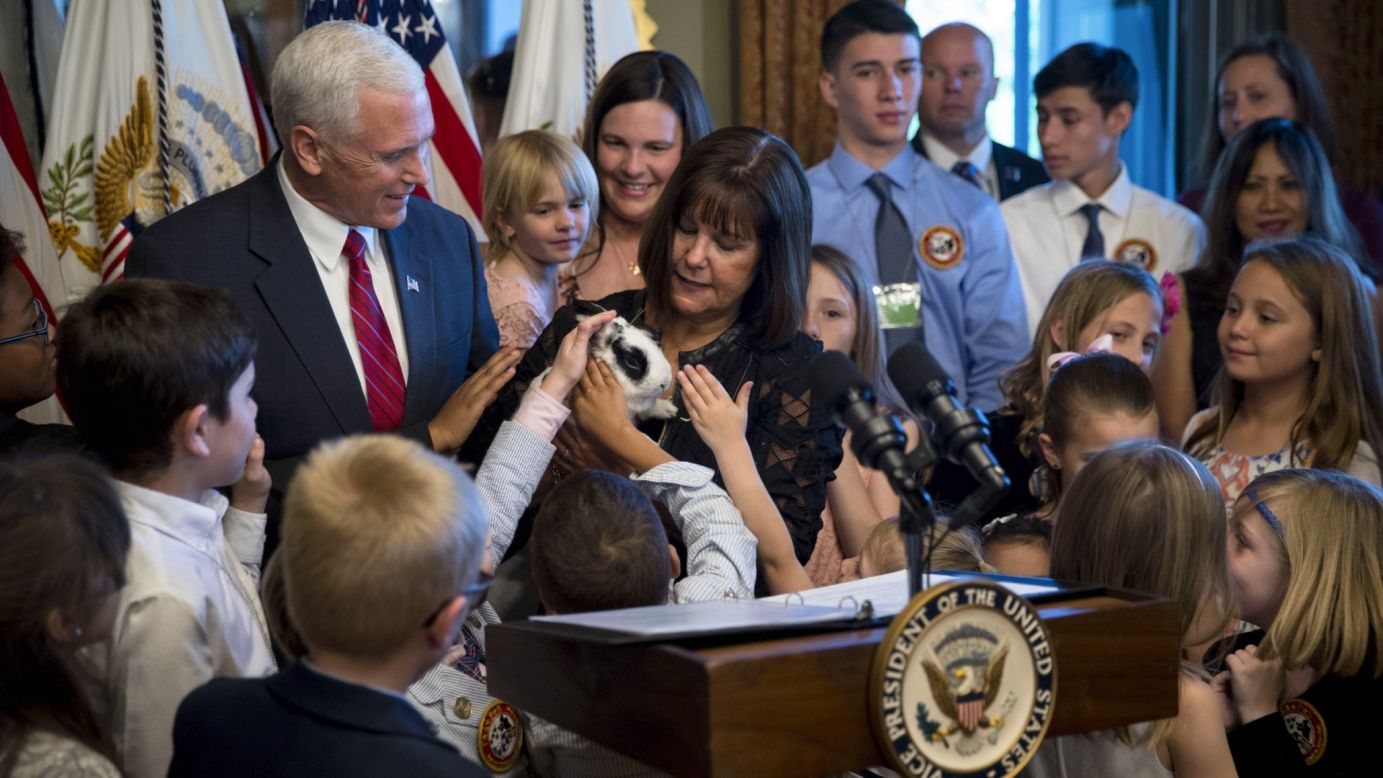 Children gather around Marlon Bundo, the pet bunny of Vice President Mike Pence and his wife, Karen, during a reception for military families Tuesday, May 9, in Washington.