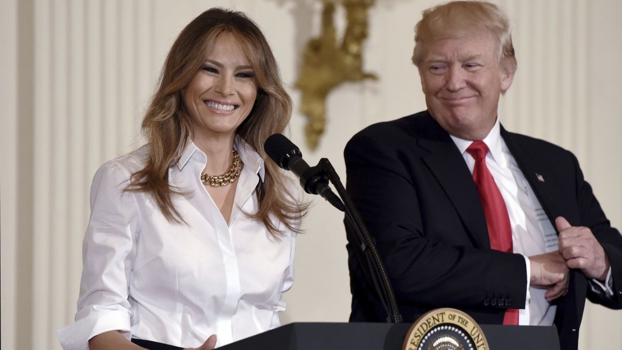 Melania Trump is joined by her husband as she speaks at a Mother's Day event at the White House.