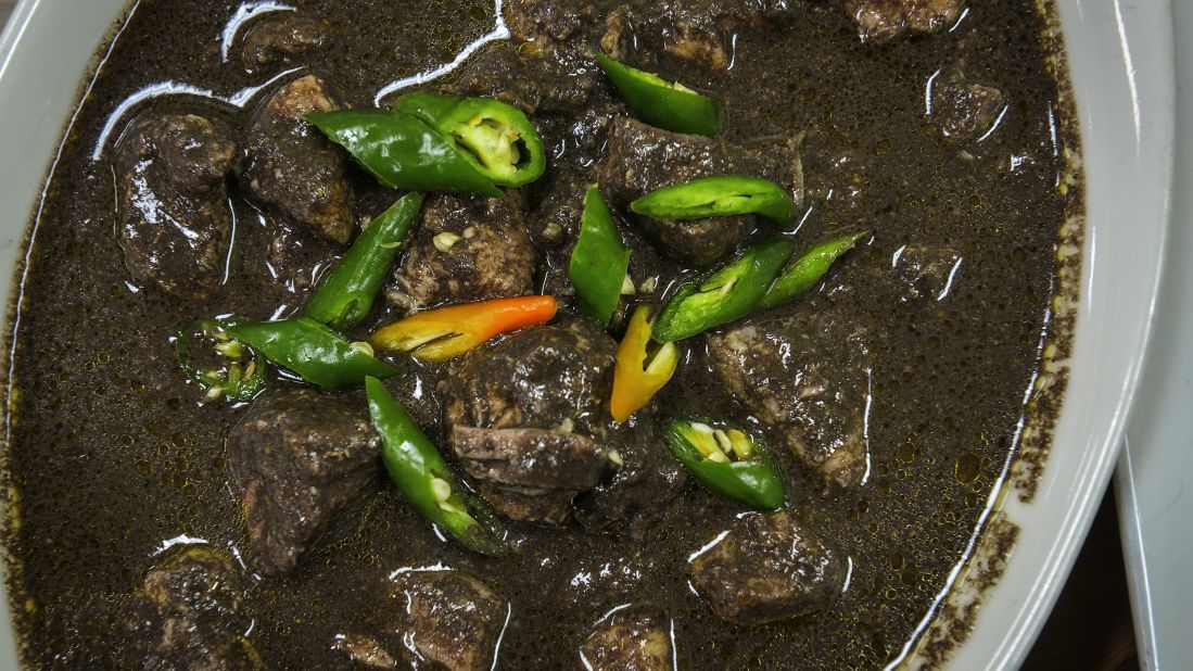 <strong>Dinuguan</strong>: Dinuguan is a Filipino stew of pork offal or other meat simmered in a rich, spicy dark gravy of pig blood.