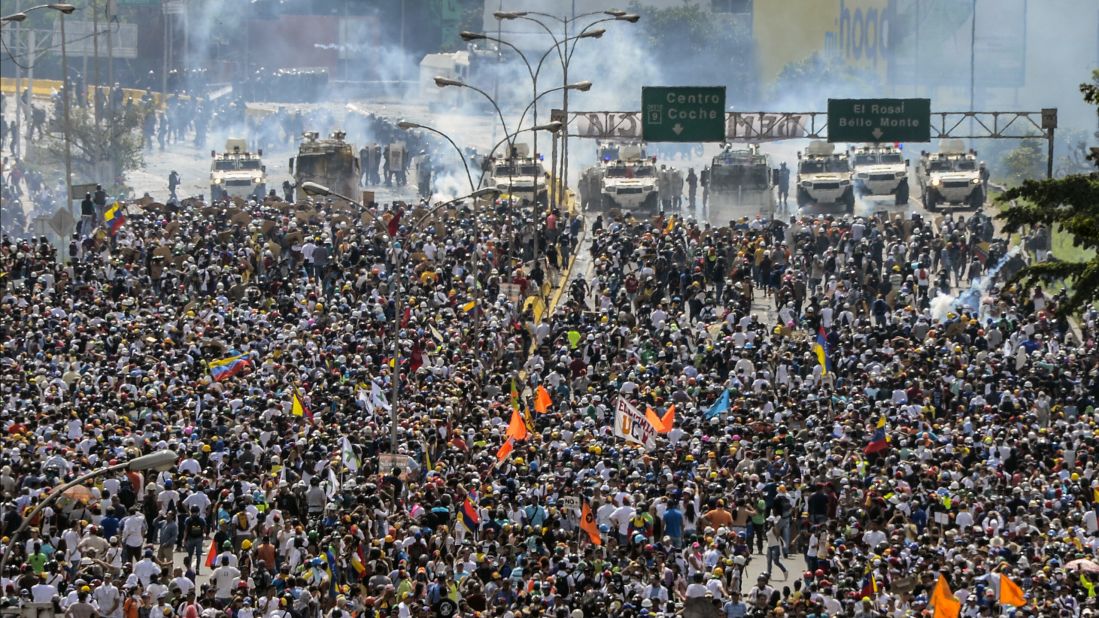 Thousands of Venezuelan protesters march on a Caracas highway on Wednesday, May 10.