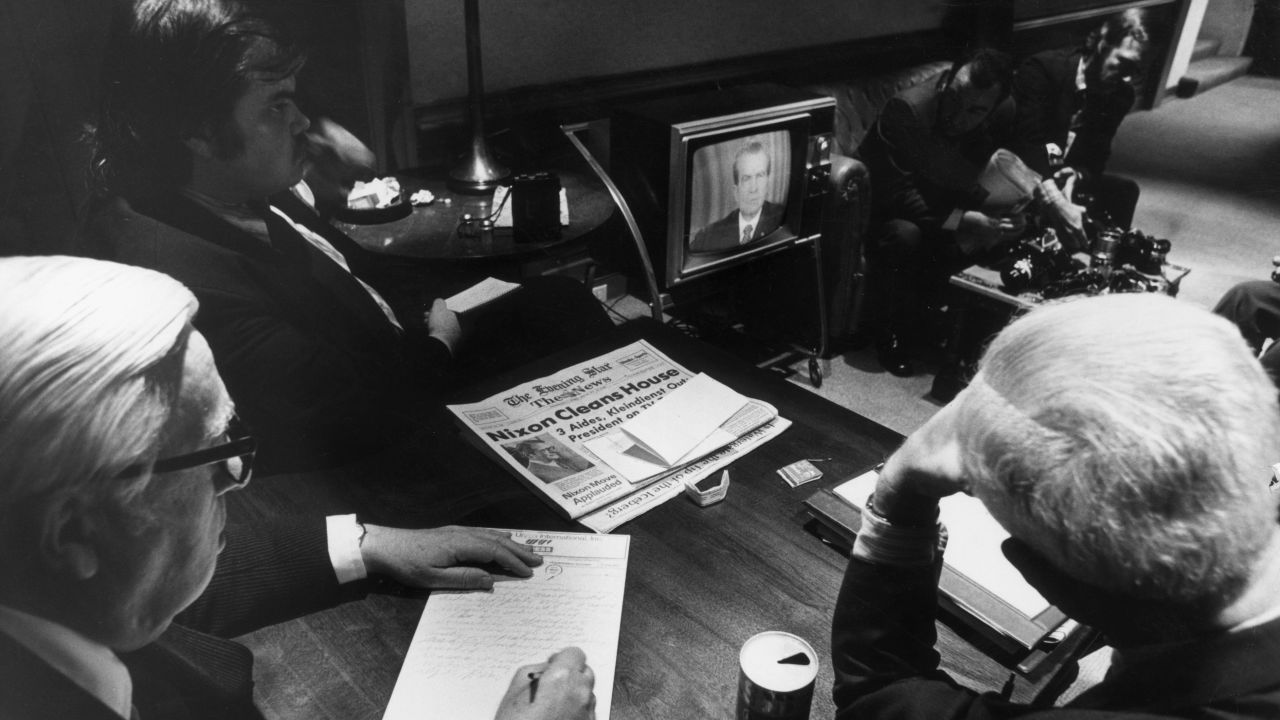 30th April 1973:  White House reporters watch President Richard Nixon on TV as he told the nation of White House involvement in the Watergate scandal, Washington D.C.  (Photo by Hulton Archive/Getty Images)