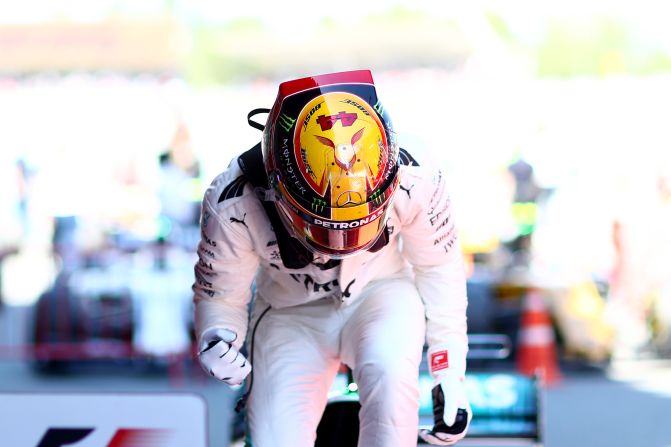 Race winner: Lewis Hamilton celebrates in parc ferme after taking the checkered flag at Sunday's Spanish Grand Prix. 
