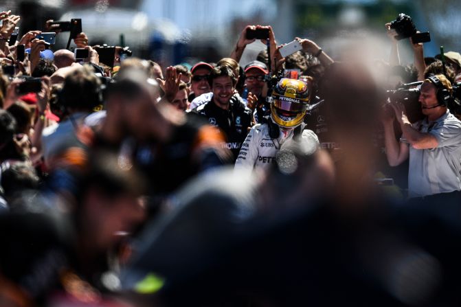 Media engulf Hamilton in parc ferme after his victory in Spain. Next stop on the F1 calendar is the Monaco Grand Prix on May 28. 