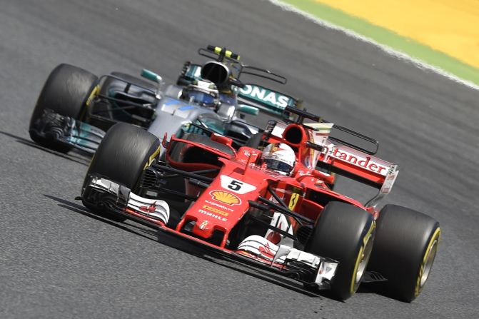 Vettel and Hamilton's teammate Valtteri Bottas vie for track position during Sunday's grand prix in Barcelona. Bottas, winner in Russia, eventually retired from the race with an engine failure.
