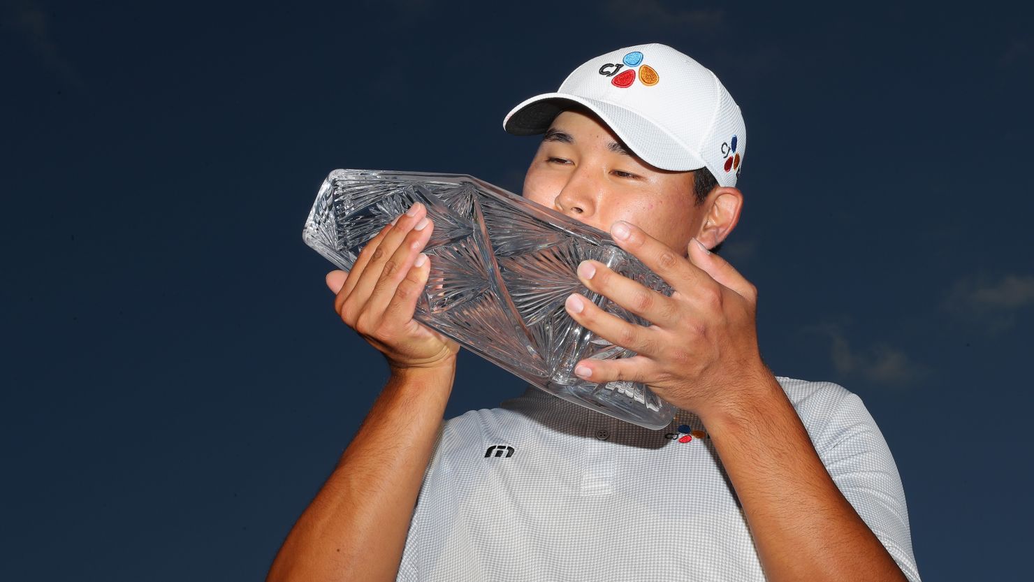 Kim Si Woo of South Korea celebrates with the winner's trophy after the final round of the 2017 Players Championship.