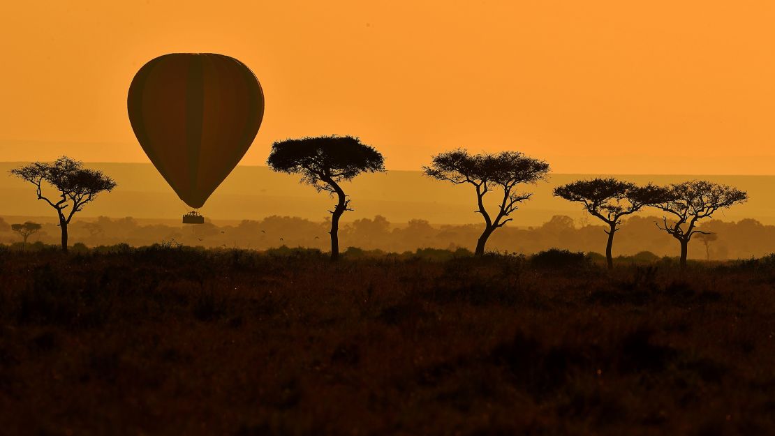  A hot air balloon carries tourists during the annual wildebeest migration in the Maasai Mara game reserve.