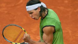 PARIS, France:  Spanish Rafael Nadal celebrates after winning against German Lars Burgsmuller after their match for the first round of the tennis French Open at Roland Garros, 23 May 2005 in Paris. Nadal won 6-1 7-6(4) 6-1. AFP PHOTO/ CHRISTOPHE SIMON  (Photo credit should read Christophe Simon/AFP/Getty Images)