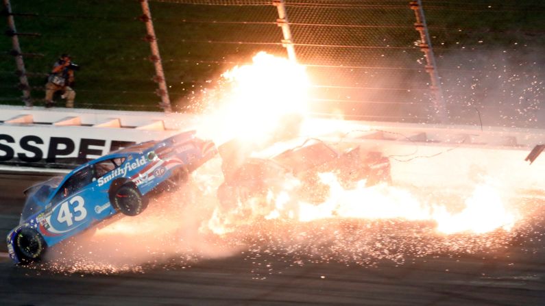 The car of Aric Almirola (No. 43) <a href="index.php?page=&url=http%3A%2F%2Fbleacherreport.com%2Farticles%2F2709595-aric-almirola-out-of-hospital-suffered-fractured-vertebra-during-fiery-crash" target="_blank" target="_blank">crashes into the car of Joey Logano</a> during the NASCAR Cup Series race at Kansas Speedway on Saturday, May 13. Almirola was airlifted to a hospital, where he was diagnosed with a fractured vertebra.