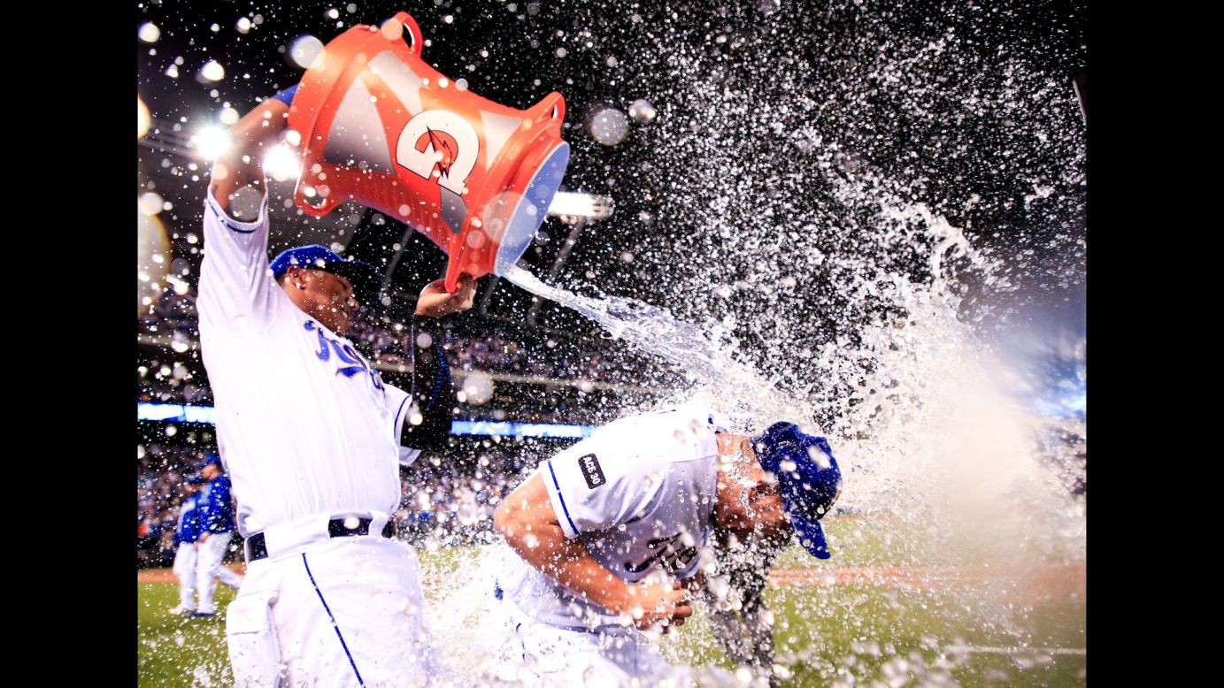 Salvador Perez dumps water onto Kansas City teammate Brandon Moss after the Royals defeated Baltimore 3-2 on Friday, May 12.