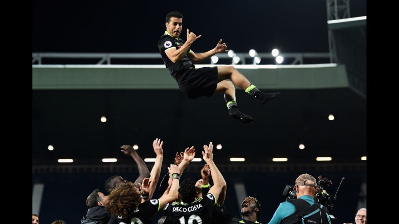 Chelsea players throw Pedro into the air after their victory at West Brom <a href="index.php?page=&url=http%3A%2F%2Fwww.cnn.com%2F2017%2F05%2F12%2Ffootball%2Fantonio-conte-chelsea-premier-league-title-winners-west-brom-batshuayi%2Findex.html" target="_blank">clinched the Premier League title</a> on Friday, May 12. It was the London club's second league title in three years.