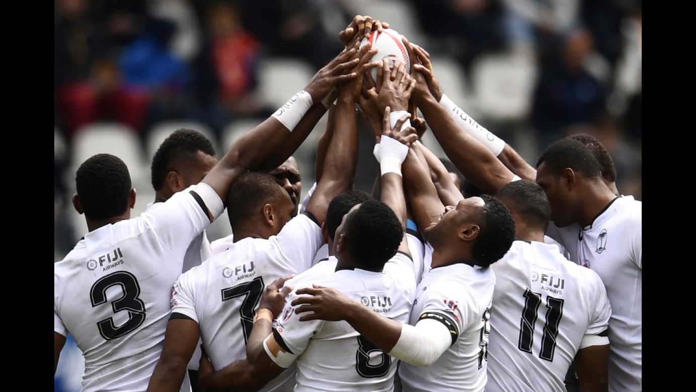 Fiji's rugby sevens team prays before a match in Paris on Sunday, May 14.