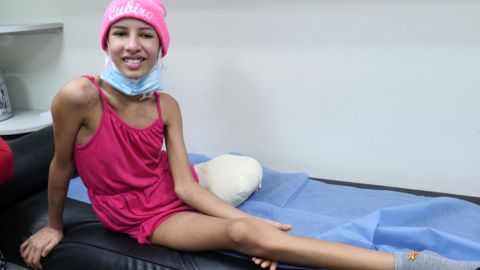 Daniela feels pain in her missing leg, amputated because there was no early detection of her cancer or medicine to treat it.