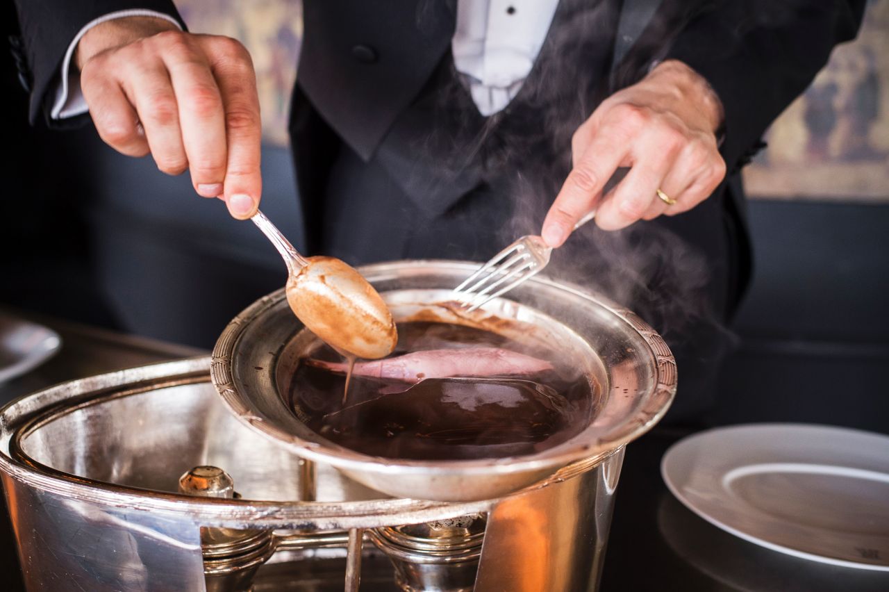 Canard a la presse, prepared at the Tour d'Argent in Paris. The restaurant claims to have served over one million ducks.