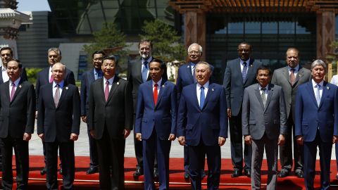 Russian President Vladimir Putin, Chinese President Xi Jinping and other world leaders pose for a group photo at the Belt and Road Forum in Beijing. 