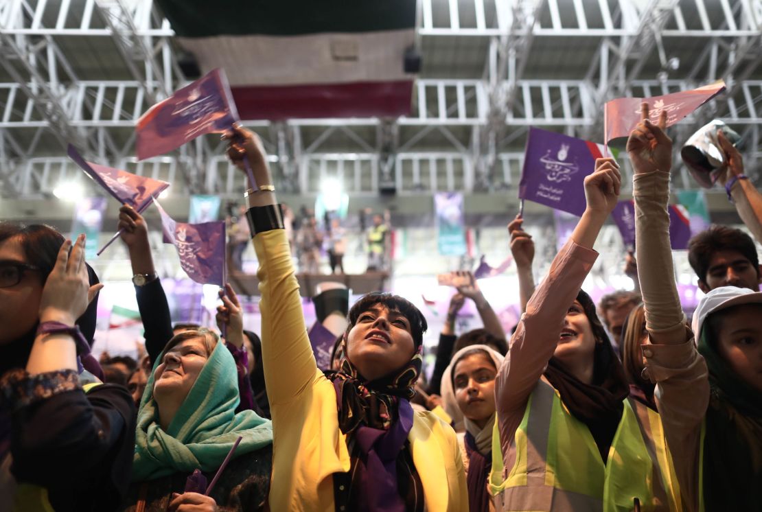 Rouhani supporters chant slogans during a rally in northwest Iran on Tuesday. 