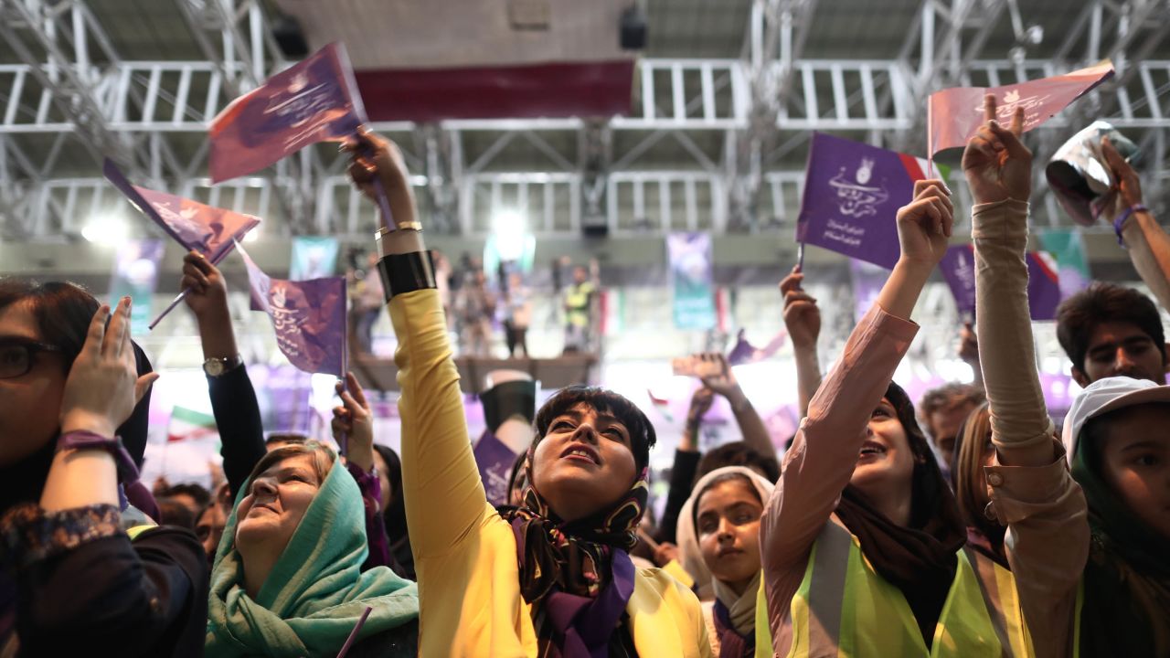 Rouhani supporters chant slogans during a rally in northwest Iran on Tuesday. 