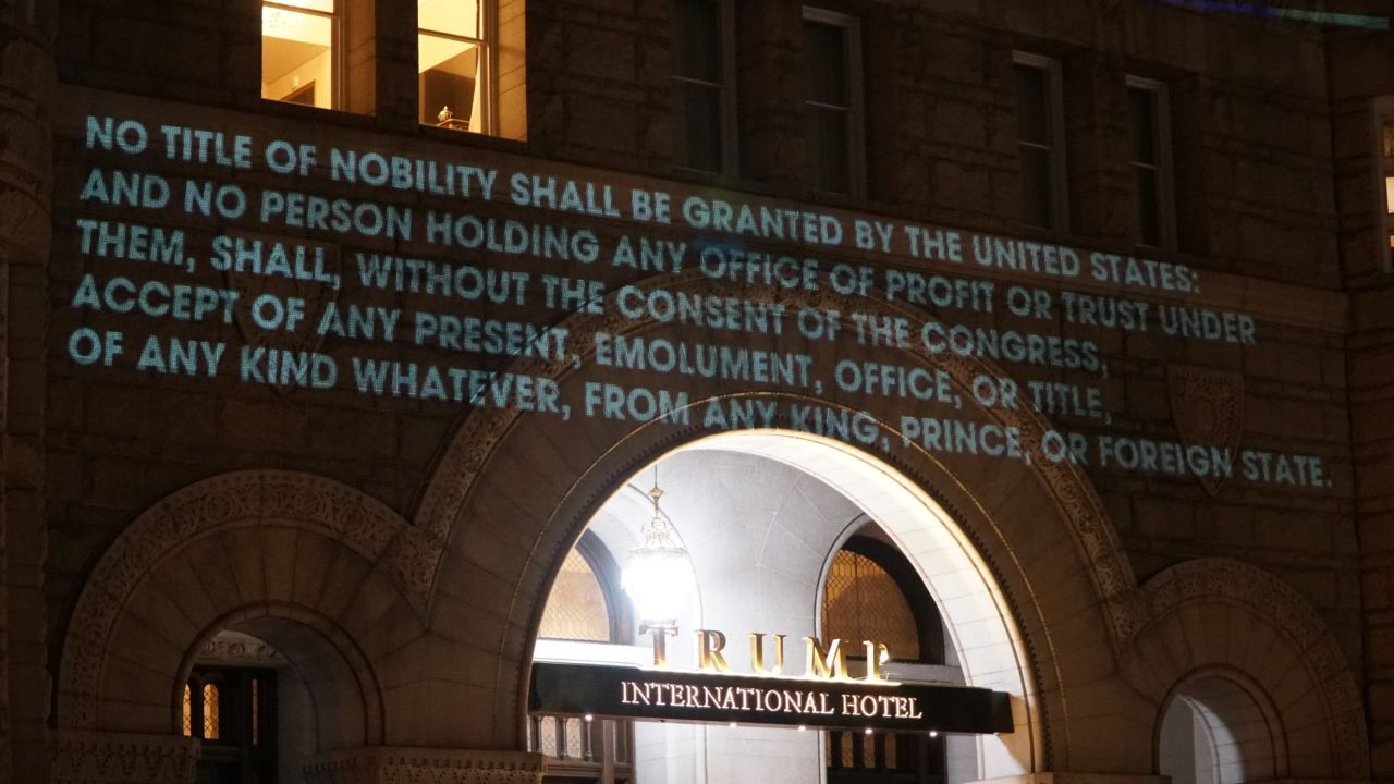 The text of the emoluments clause was projected onto the hotel.