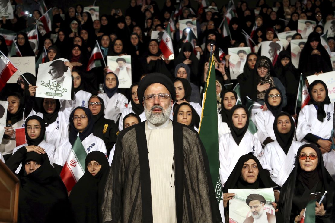 Ebrahim Raisi stands among his supporters during an April campaign rally in Tehran.
