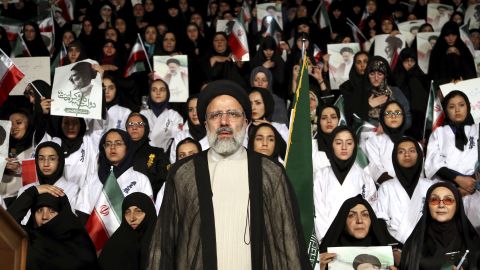 Ebrahim Raisi stands among his supporters during an April campaign rally in Tehran.