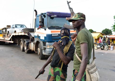 Mutinous soldiers pose with their weapons in Bouake. 