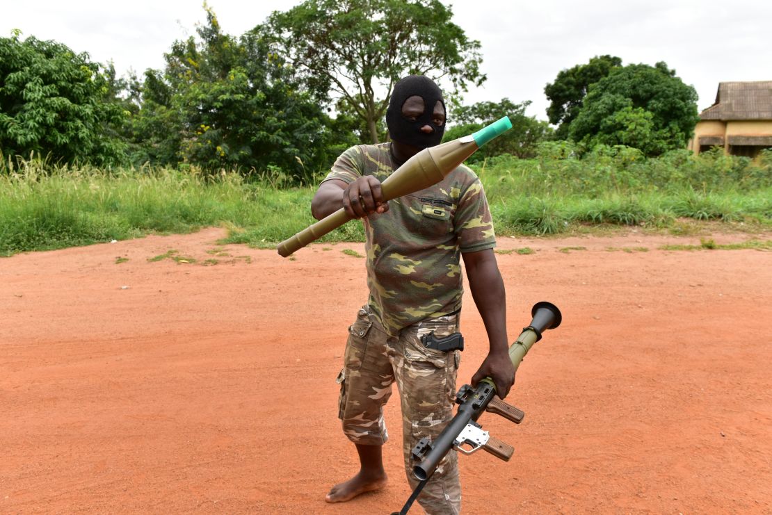 A mutinous soldier holds a RPG rocket launcher inside a military camp in the Ivory Coast's central second city Bouake.