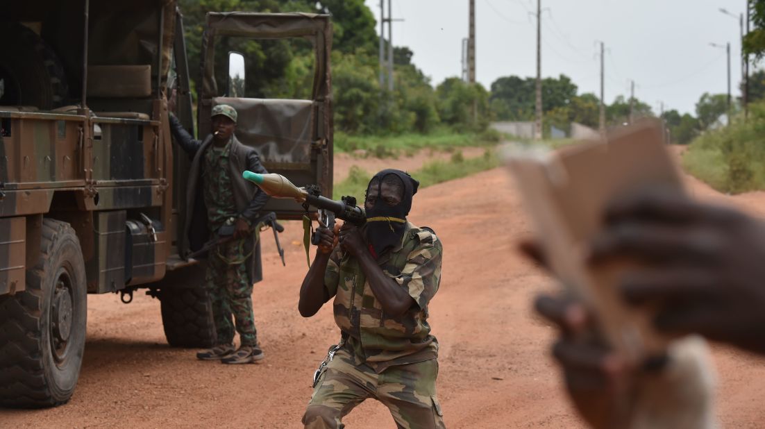 A mutinous soldier holds a RPG rocket launcher inside a military camp in Bouake. <br /><br />This is the rebels' second major uprising in the Ivory Coast this year. The previous dispute ended with a compromise payment. Rebels say they will continue this uprising until they are paid seven million CFA ($11,720).